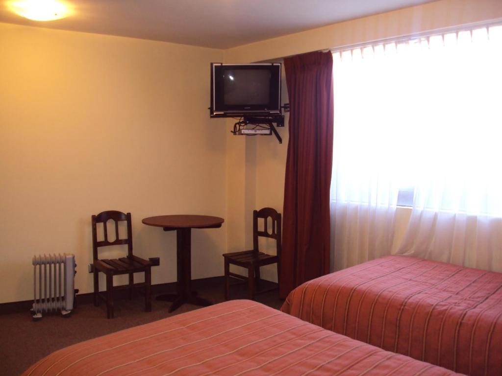 Mosoq Inn Puno Habitación foto